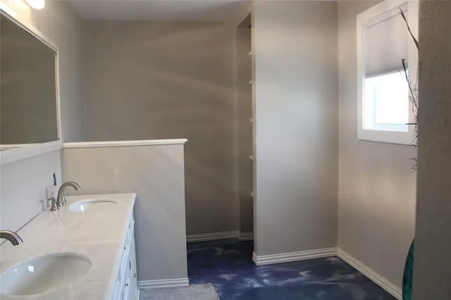 a bathroom with a sink and a vanity