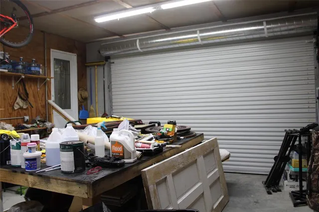 a backyard of a house with yard table and chairs