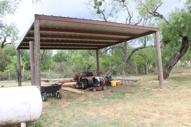 a view of a tree in front of a house
