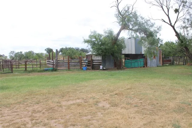 a view of a chairs and table in patio