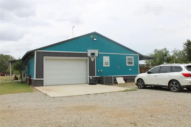 a view of parking space in front of a house