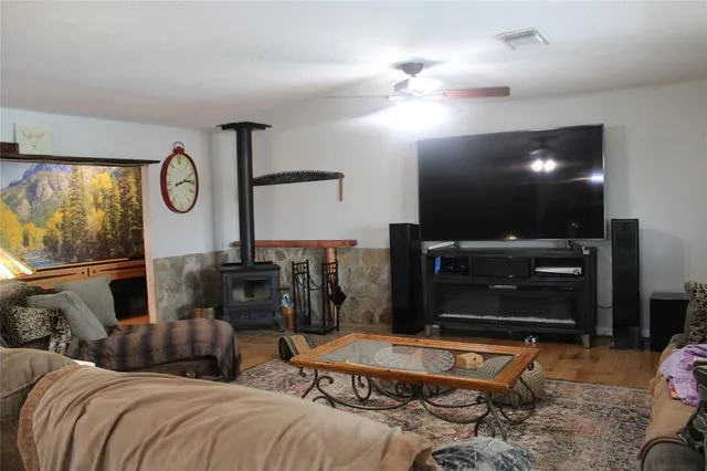 a bedroom with furniture and a large mirror