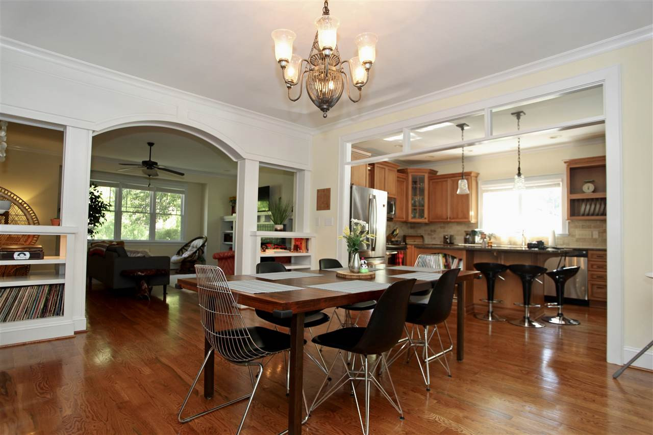 2815 Van Dyke Avenue Raleigh, NC 27607 - Photo 6 of 30 Room for more than a few guests. This open Dinning area is surrounded by simple detail with beautiful transom windows, archways and double sided built ins. Dinning Area