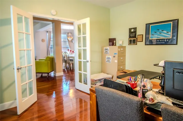 a bedroom with furniture and a window
