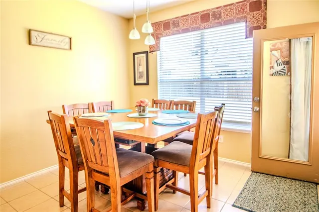 a kitchen with stainless steel appliances kitchen island granite countertop a sink and cabinets