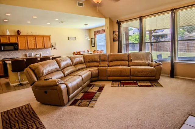 a dining room with furniture and wooden floor