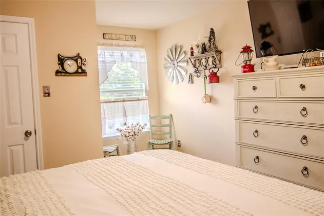 a view of a dining room with furniture and a window