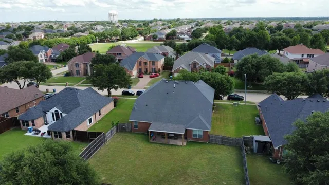 a view of a house with a garden and plants