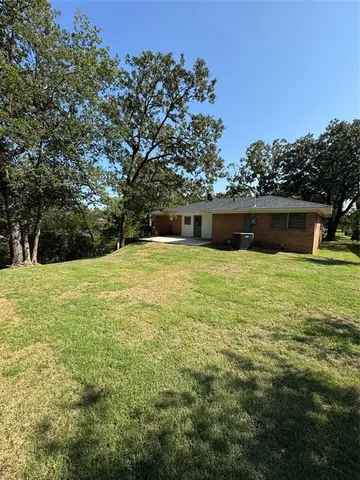 a view of a pool with a yard
