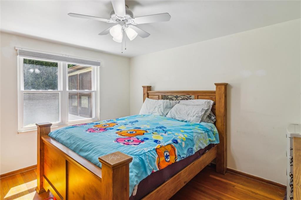 1616 Glenbrook Avenue Coraopolis, PA 15108 - Photo 18 of 31 a bedroom with a bed and a table in it