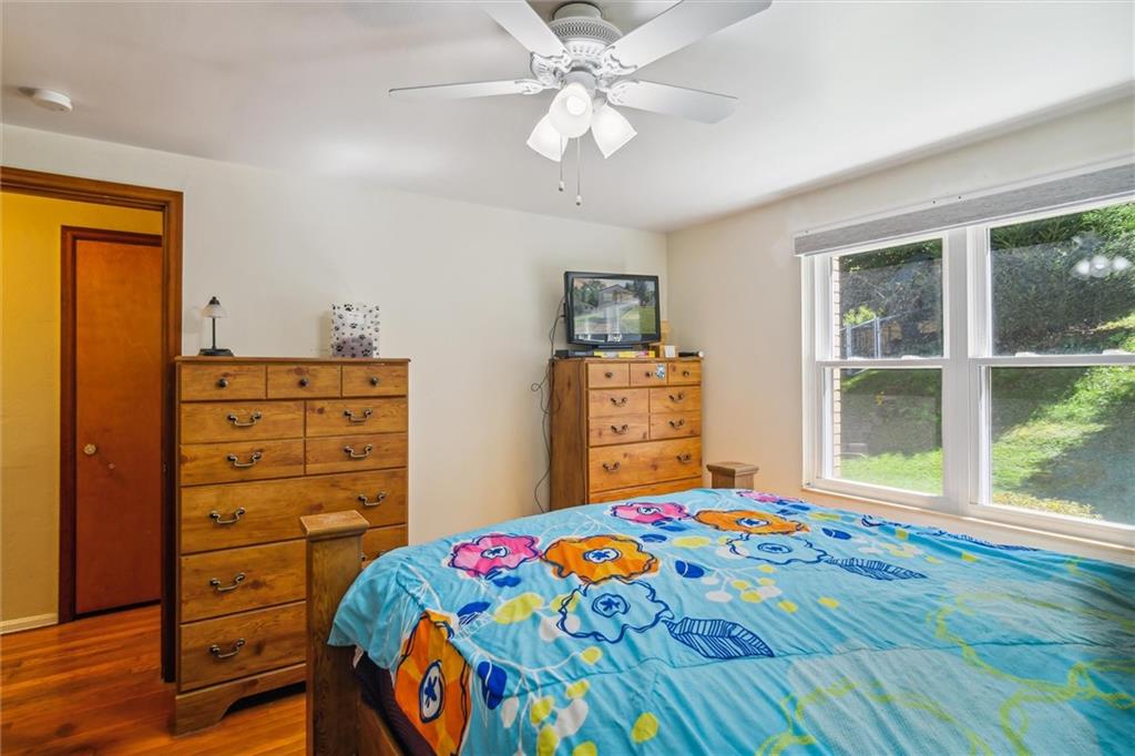 1616 Glenbrook Avenue Coraopolis, PA 15108 - Photo 19 of 31 a bedroom with a bed and a dresser
