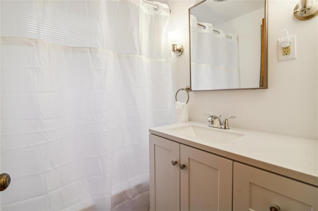 1616 Glenbrook Avenue Coraopolis, PA 15108 - Photo 20 of 31 a bathroom with a granite countertop sink and a mirror