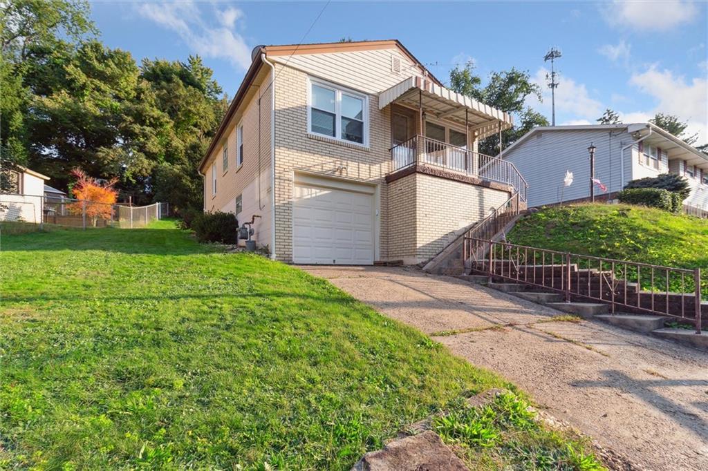 1616 Glenbrook Avenue Coraopolis, PA 15108 - Photo 2 of 31 front view of house with a yard
