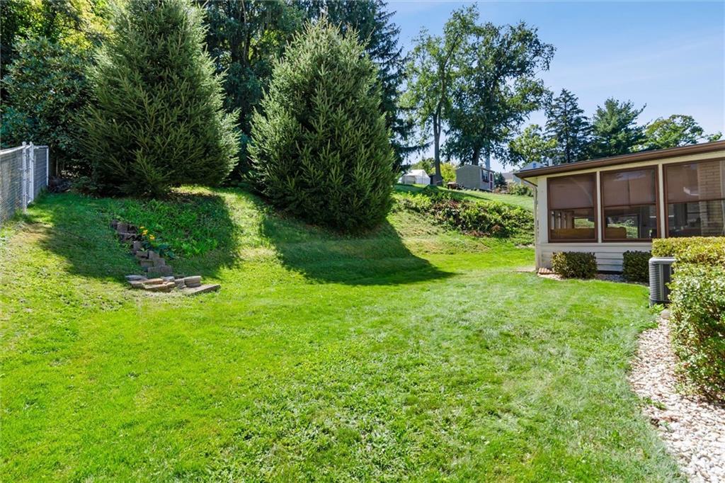1616 Glenbrook Avenue Coraopolis, PA 15108 - Photo 30 of 31 a view of a backyard with potted plants and large trees