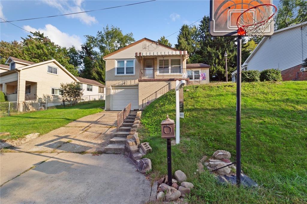 1616 Glenbrook Avenue Coraopolis, PA 15108 - Photo 3 of 31 a front view of a house with garden