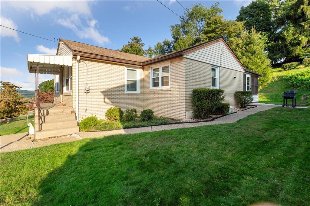 1616 Glenbrook Avenue Coraopolis, PA 15108 - Photo 4 of 31 a view of an house with backyard space and garden