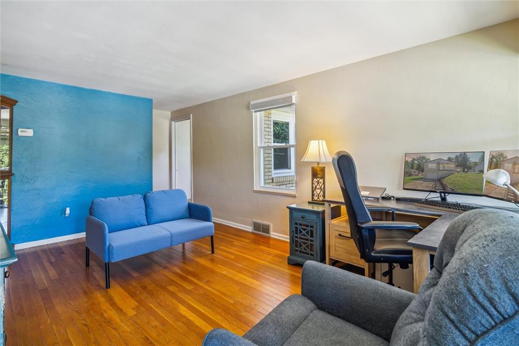 1616 Glenbrook Avenue Coraopolis, PA 15108 - Photo 7 of 31 a living room with furniture and a wooden floor