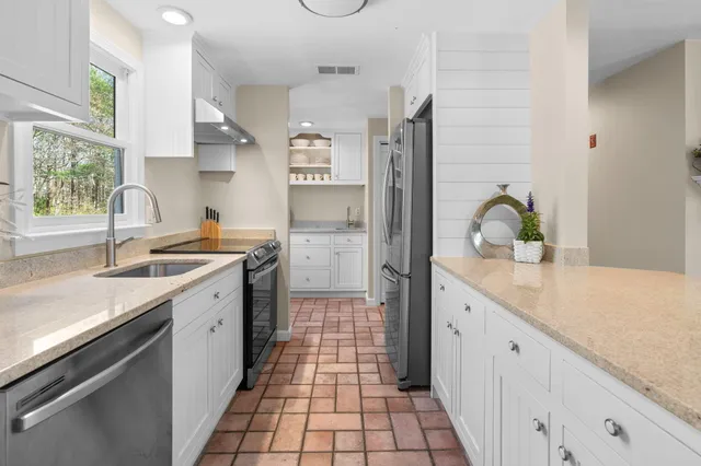 a kitchen with a sink and cabinets