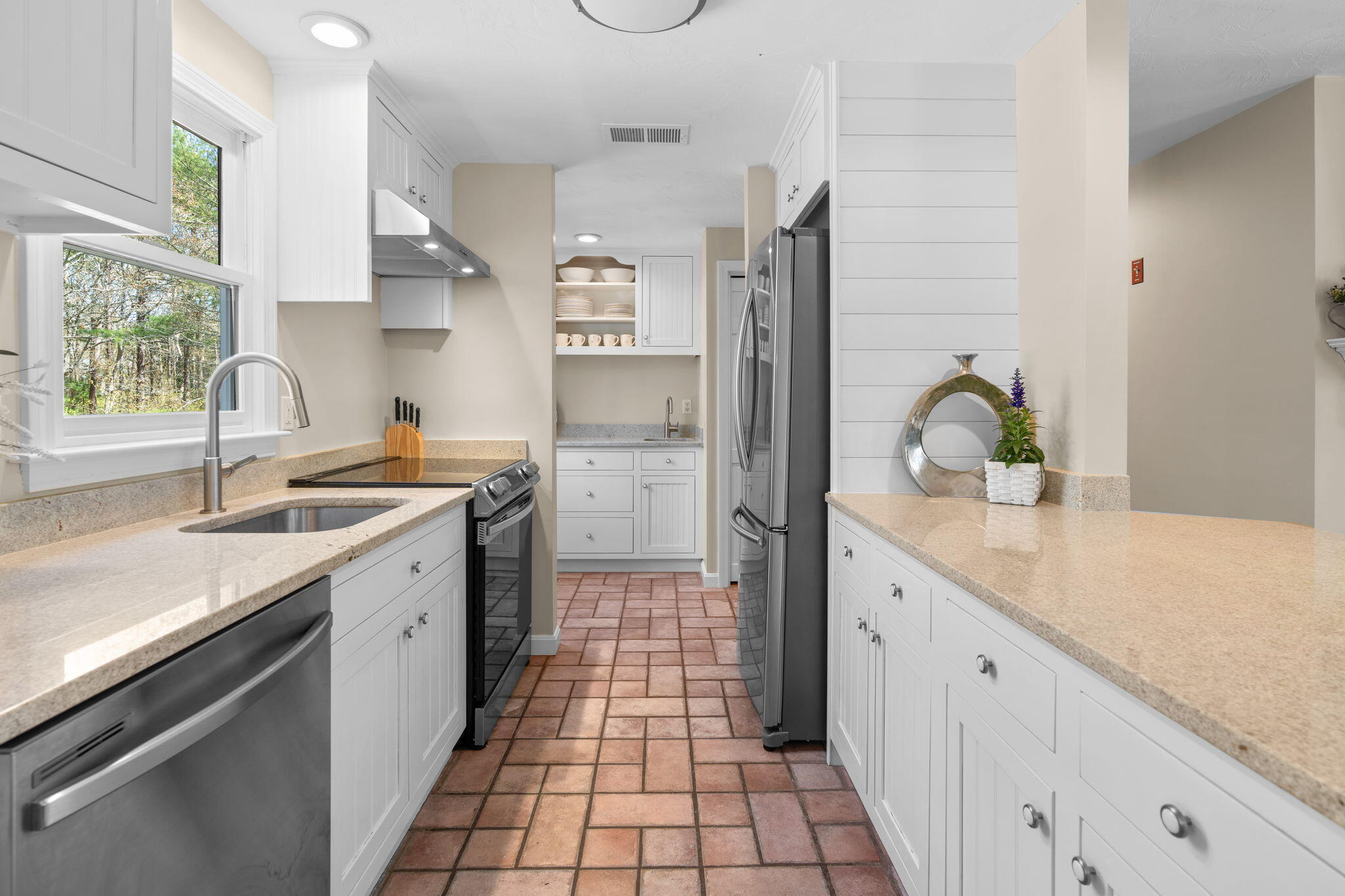 43 Neshobe Road Mashpee, MA 02649 - Photo 15 of 48 a kitchen with a sink and cabinets