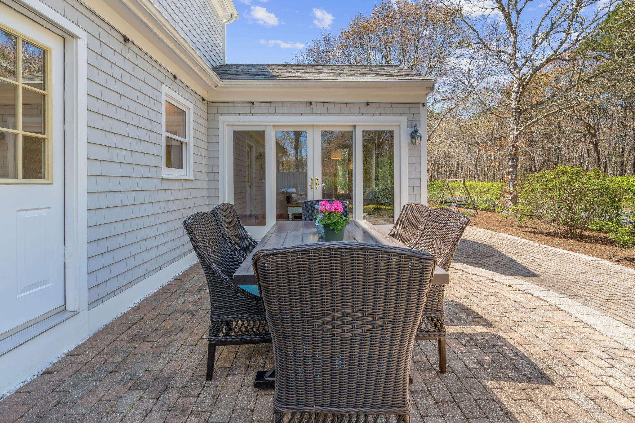43 Neshobe Road Mashpee, MA 02649 - Photo 25 of 48 a view of a patio with a table and chairs