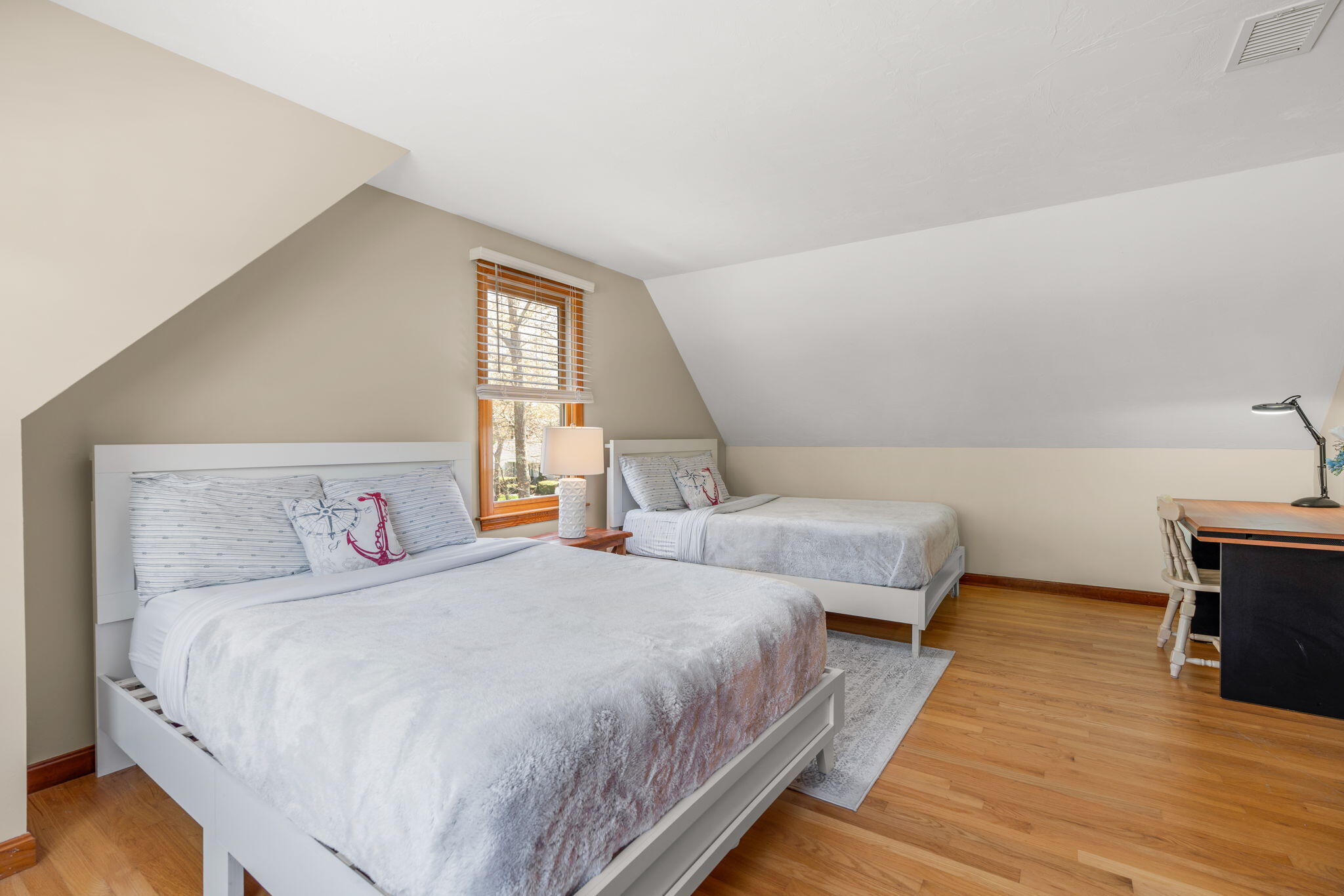 43 Neshobe Road Mashpee, MA 02649 - Photo 31 of 48 a bedroom with two beds and a night stand