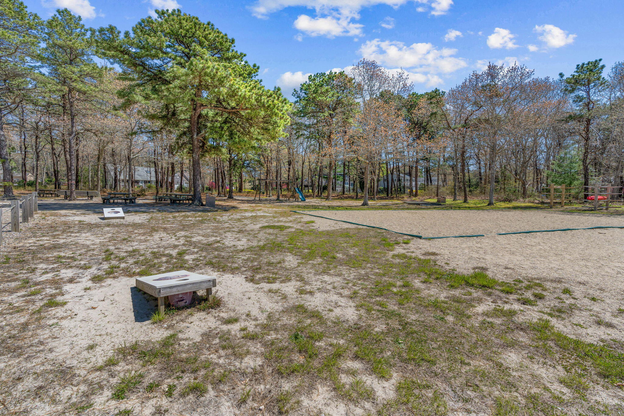 43 Neshobe Road Mashpee, MA 02649 - Photo 44 of 48 a backyard of a house with lots of green space