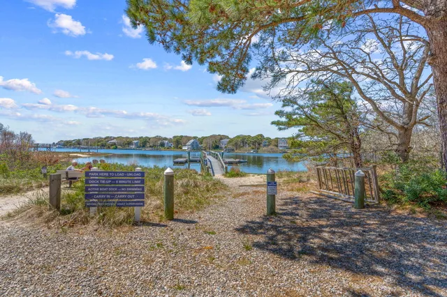 a view of a lake with houses in the back