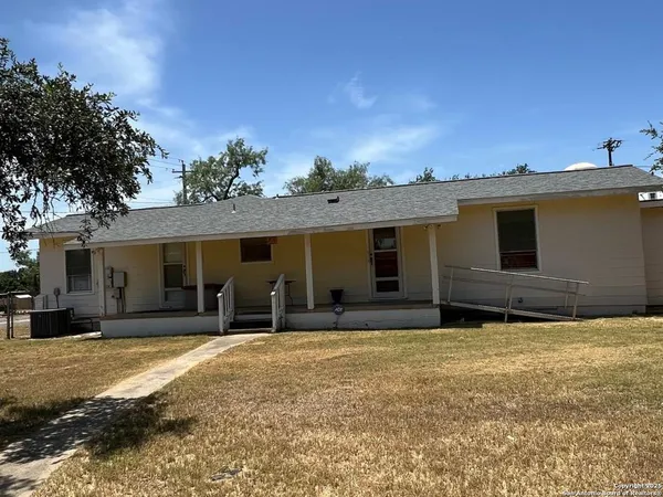 a house that has a big yard in front of it