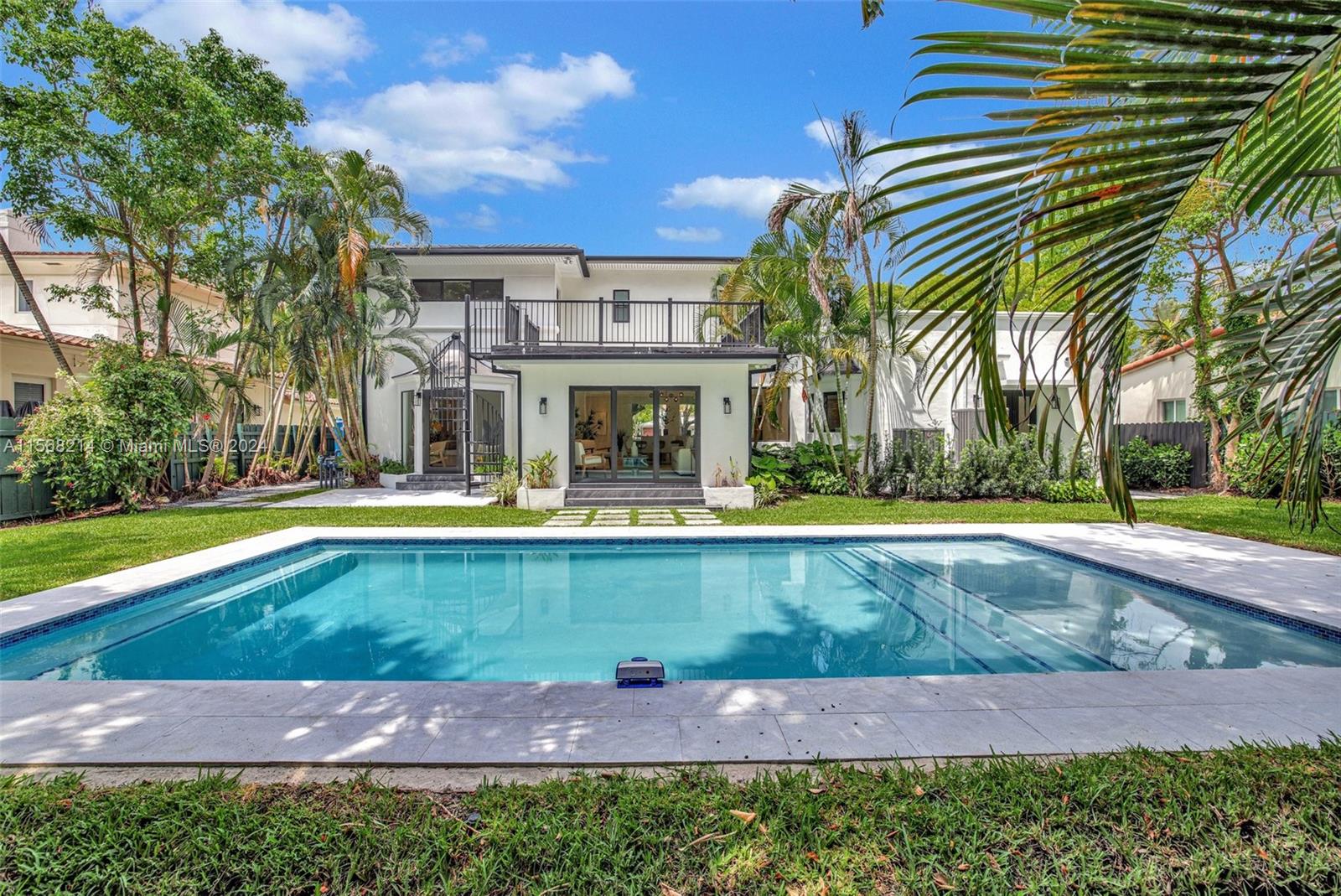 4321 Alton Road Miami Beach, FL 33140 - Photo 1 of 56 a view of outdoor space yard and swimming pool