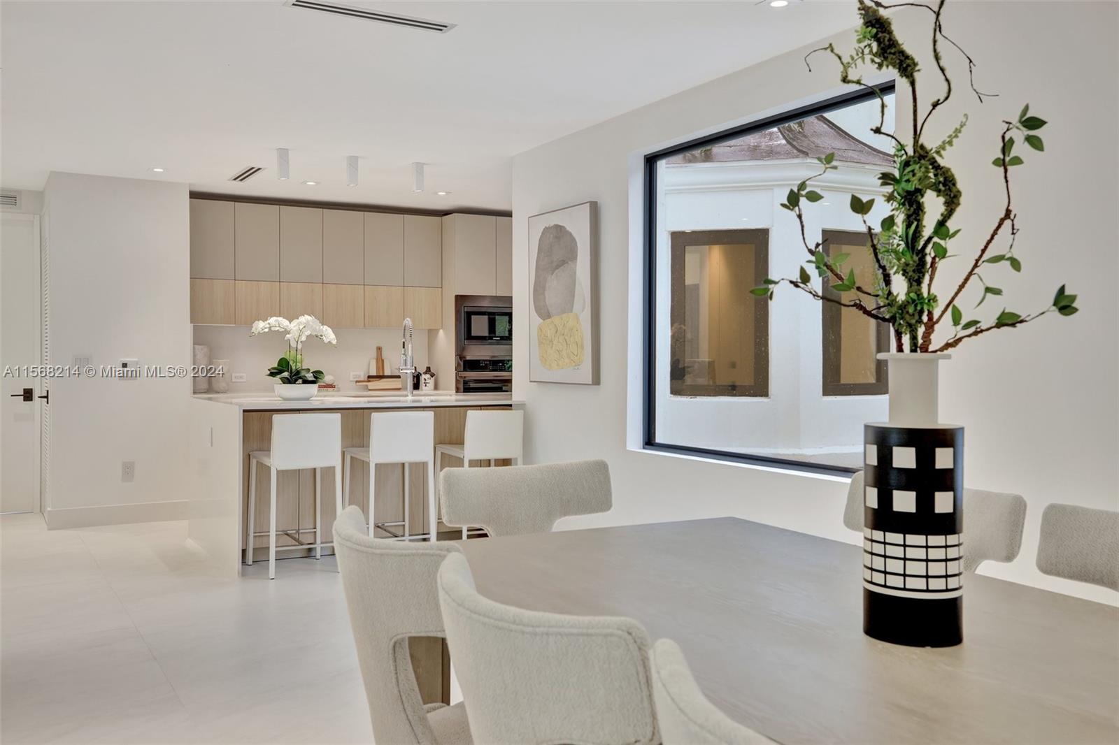4321 Alton Road Miami Beach, FL 33140 - Photo 12 of 56 a dining room with furniture and window