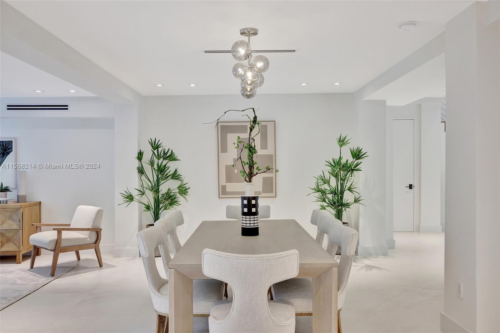 4321 Alton Road Miami Beach, FL 33140 - Photo 15 of 56 a dining room with furniture potted plants and wooden floor