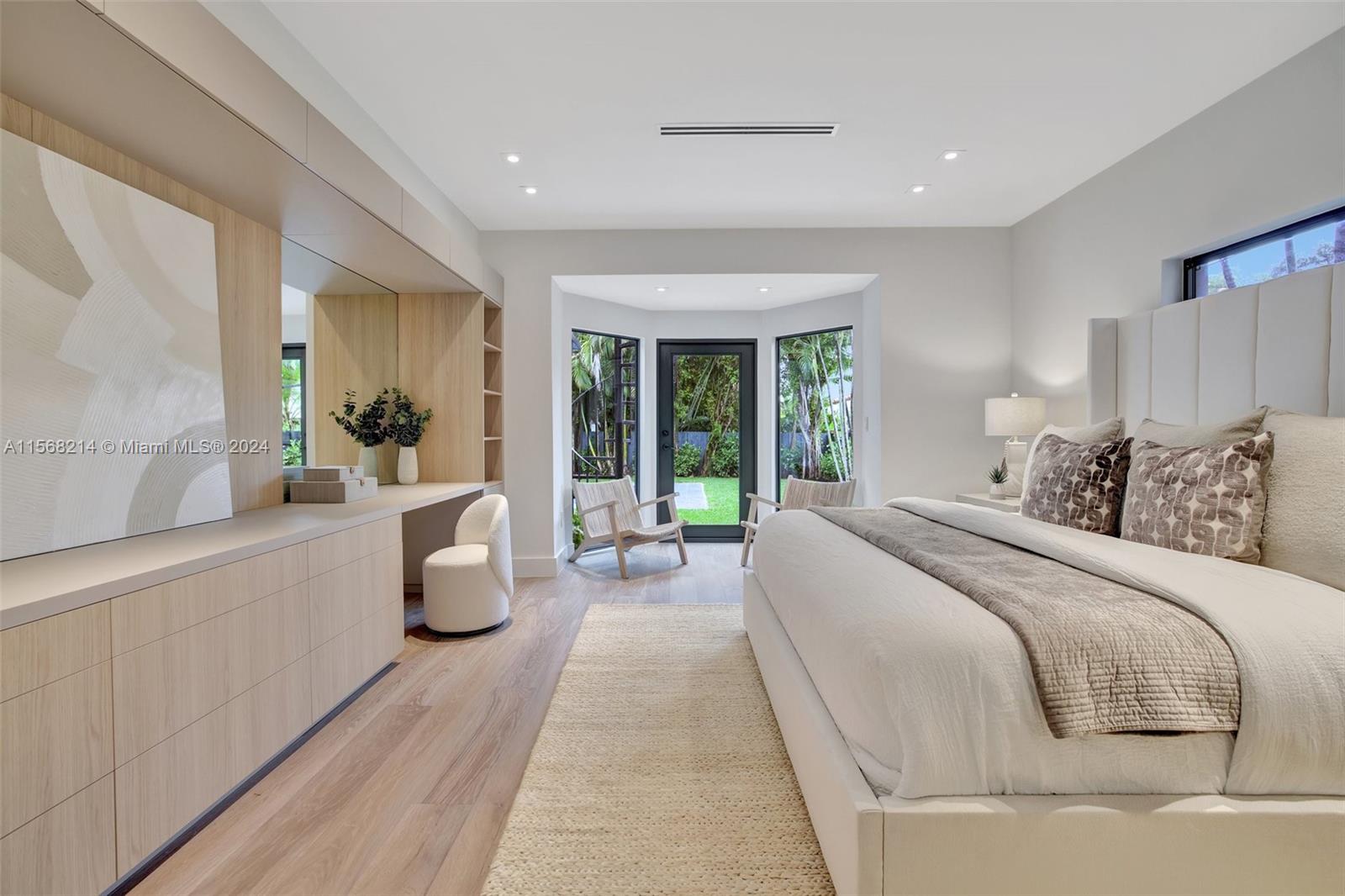 4321 Alton Road Miami Beach, FL 33140 - Photo 29 of 56 a bed room with a bed and a large window
