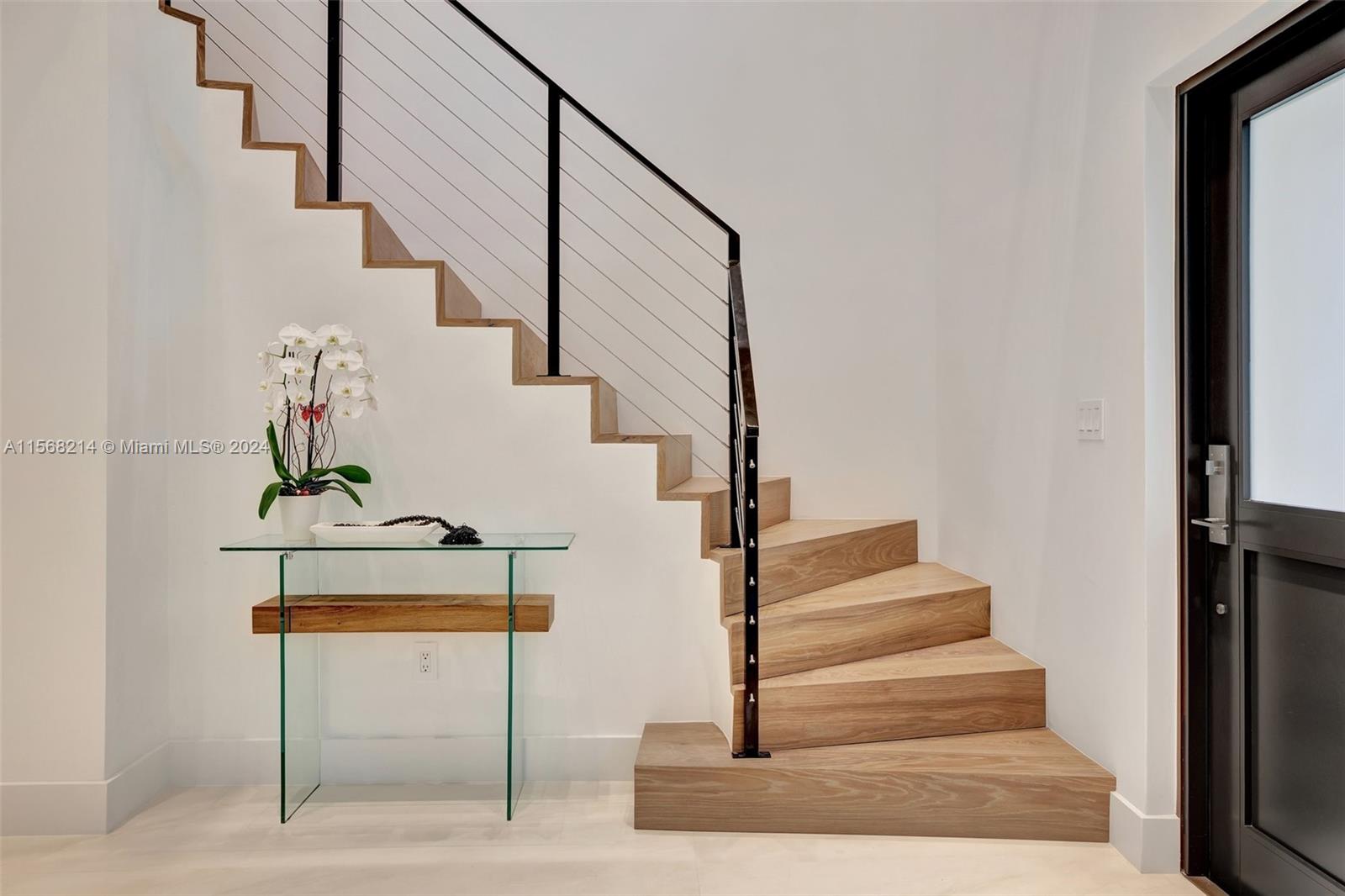 4321 Alton Road Miami Beach, FL 33140 - Photo 32 of 56 a view of entryway and hall with wooden floor