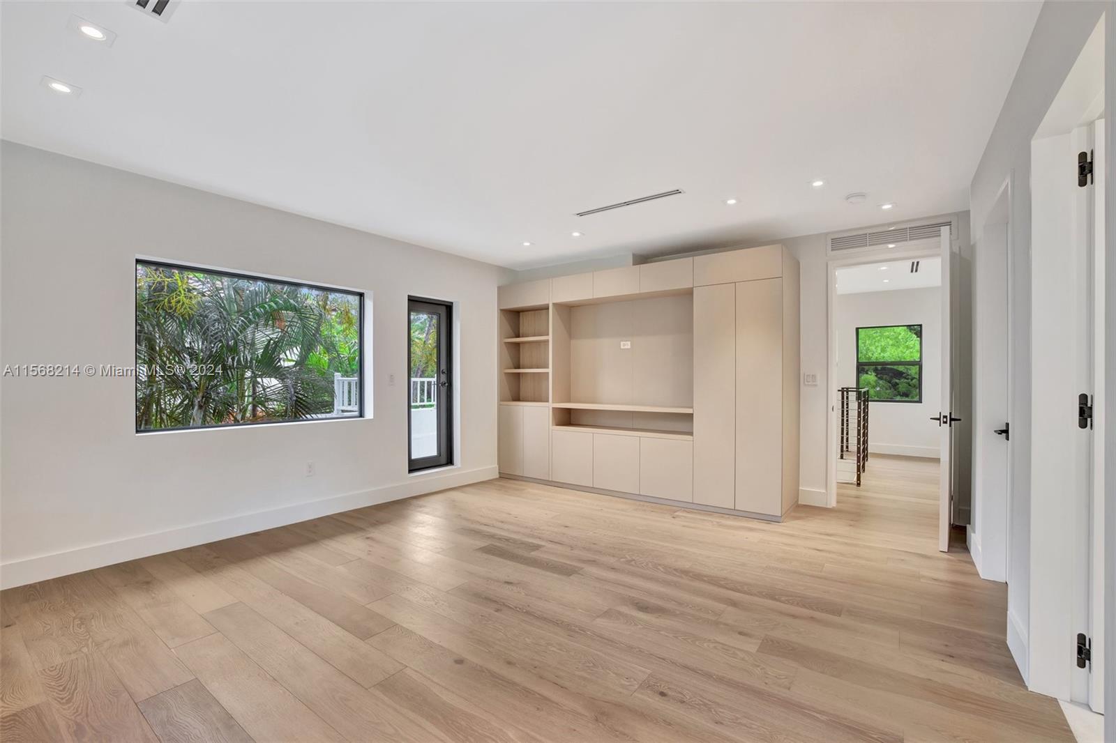 4321 Alton Road Miami Beach, FL 33140 - Photo 35 of 56 a view of empty room with wooden floor and fan