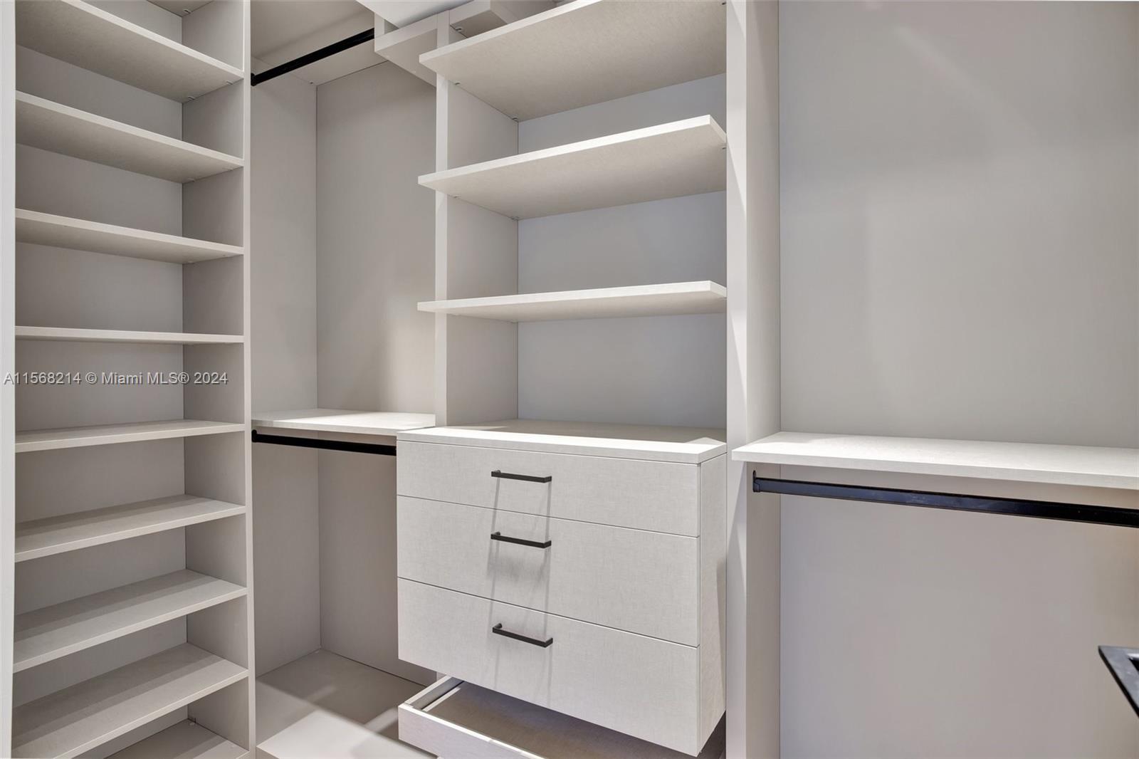 4321 Alton Road Miami Beach, FL 33140 - Photo 37 of 56 a view of an empty walk in closet