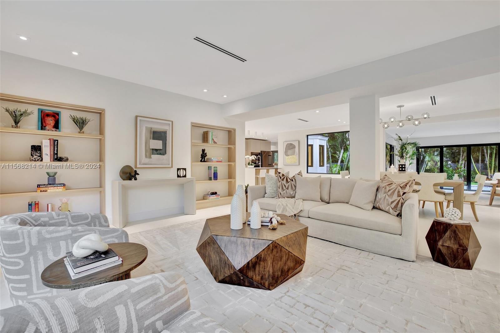 4321 Alton Road Miami Beach, FL 33140 - Photo 4 of 56 a living room with furniture and a wooden floor