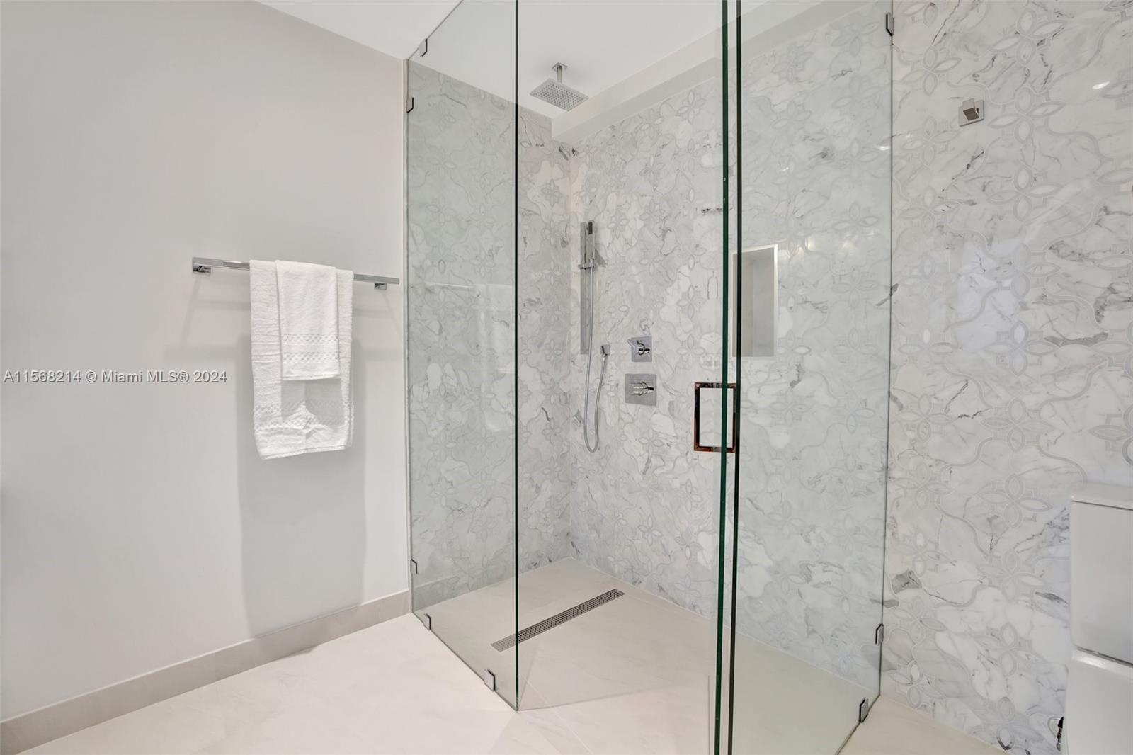 4321 Alton Road Miami Beach, FL 33140 - Photo 44 of 56 a bathroom with a shower and a sink