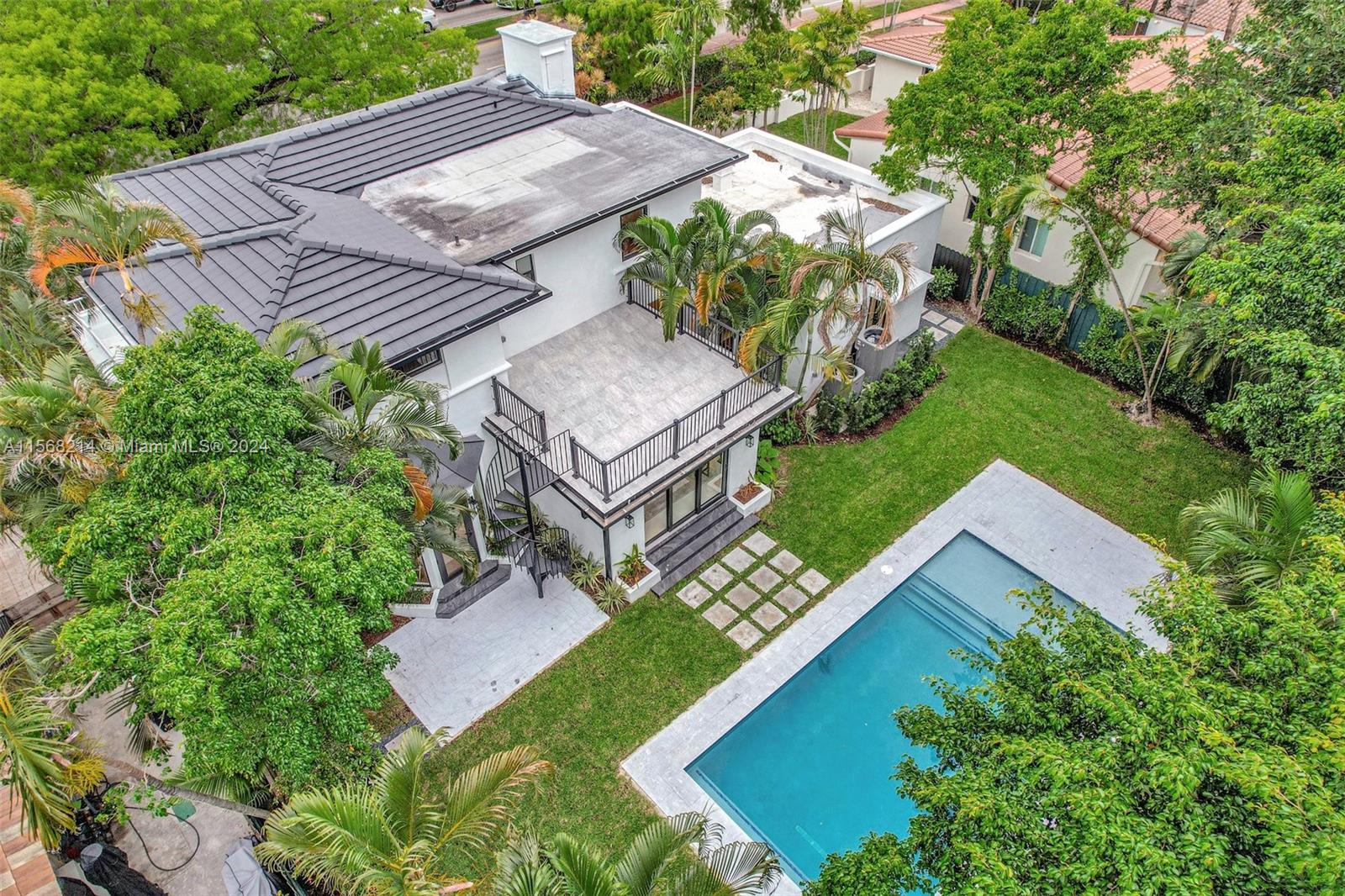 4321 Alton Road Miami Beach, FL 33140 - Photo 48 of 56 an aerial view of a house with a garden