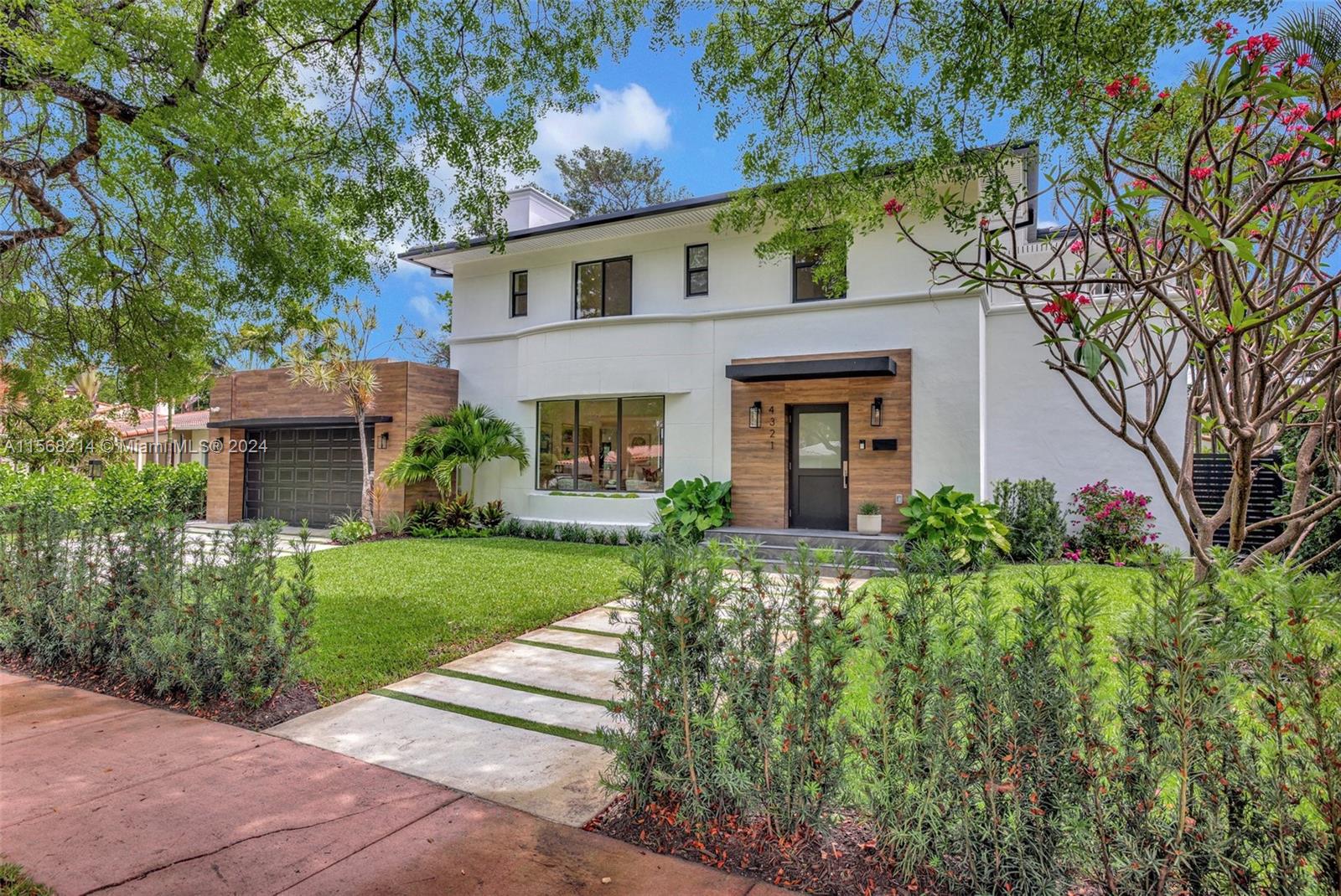 4321 Alton Road Miami Beach, FL 33140 - Photo 50 of 56 front view of a house with a yard