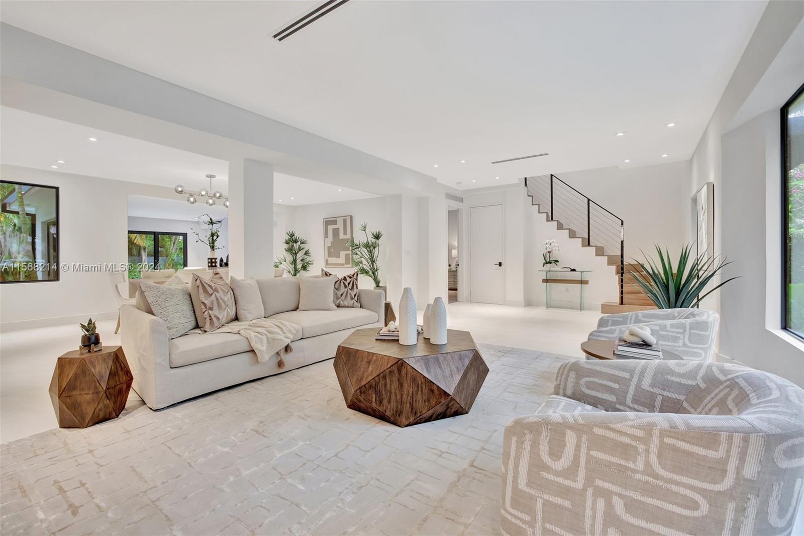 4321 Alton Road Miami Beach, FL 33140 - Photo 5 of 56 a living room with furniture and a potted plant