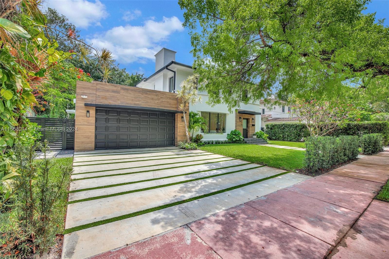 4321 Alton Road Miami Beach, FL 33140 - Photo 51 of 56 a front view of a house with a yard