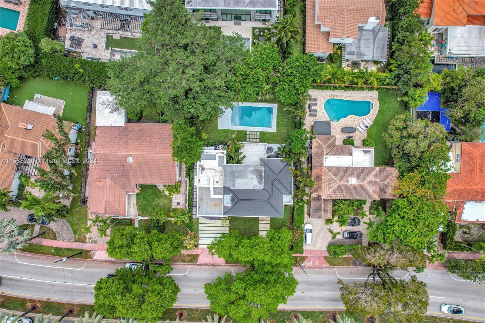 4321 Alton Road Miami Beach, FL 33140 - Photo 52 of 56 an aerial view of a house with a yard and a garden