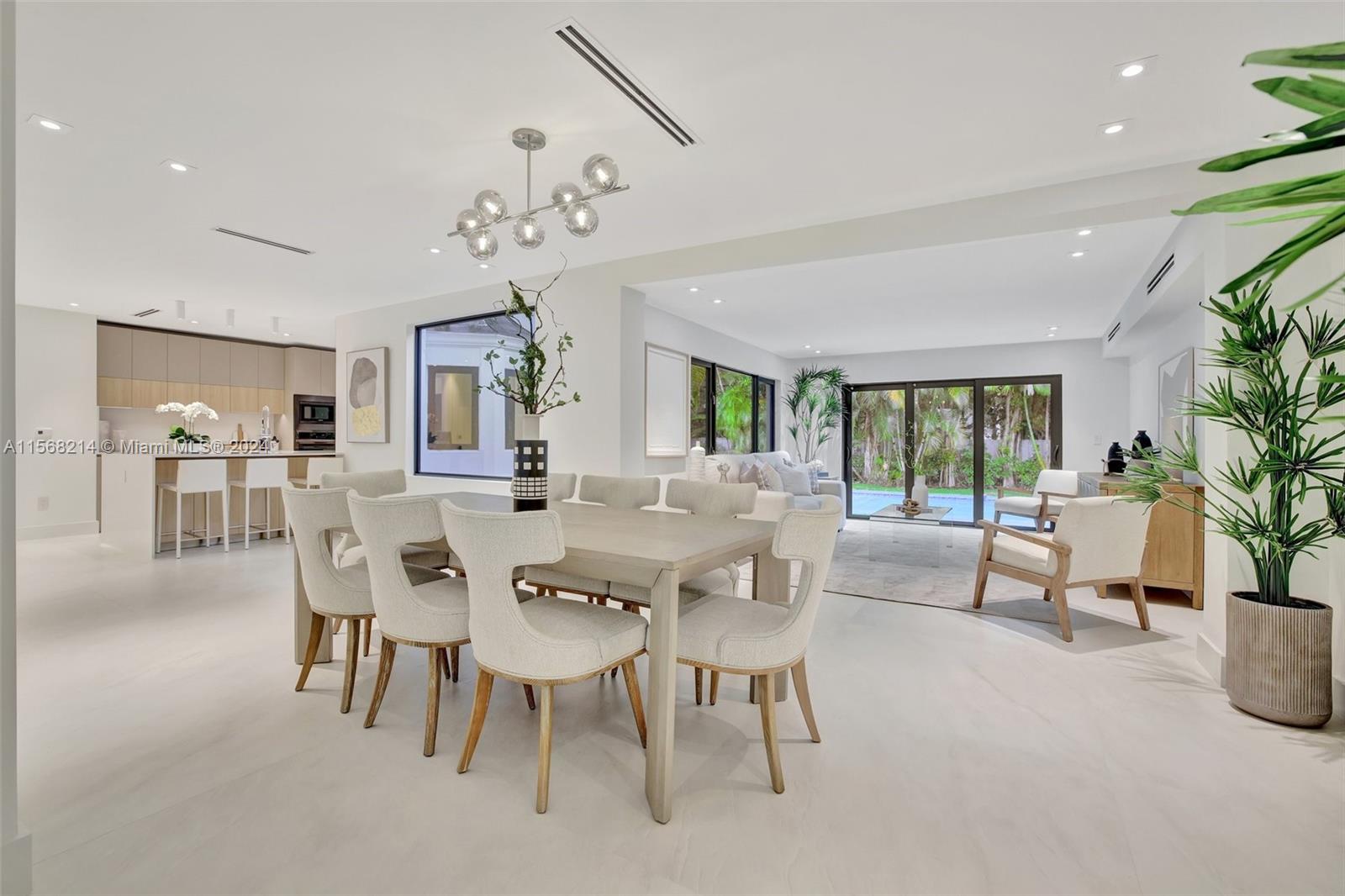 4321 Alton Road Miami Beach, FL 33140 - Photo 6 of 56 a view of a dining room with furniture and a potted plant