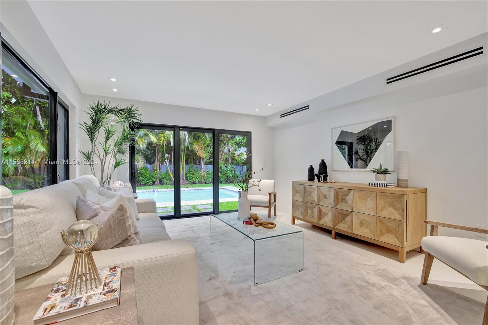 4321 Alton Road Miami Beach, FL 33140 - Photo 8 of 56 a living room with furniture and a large window