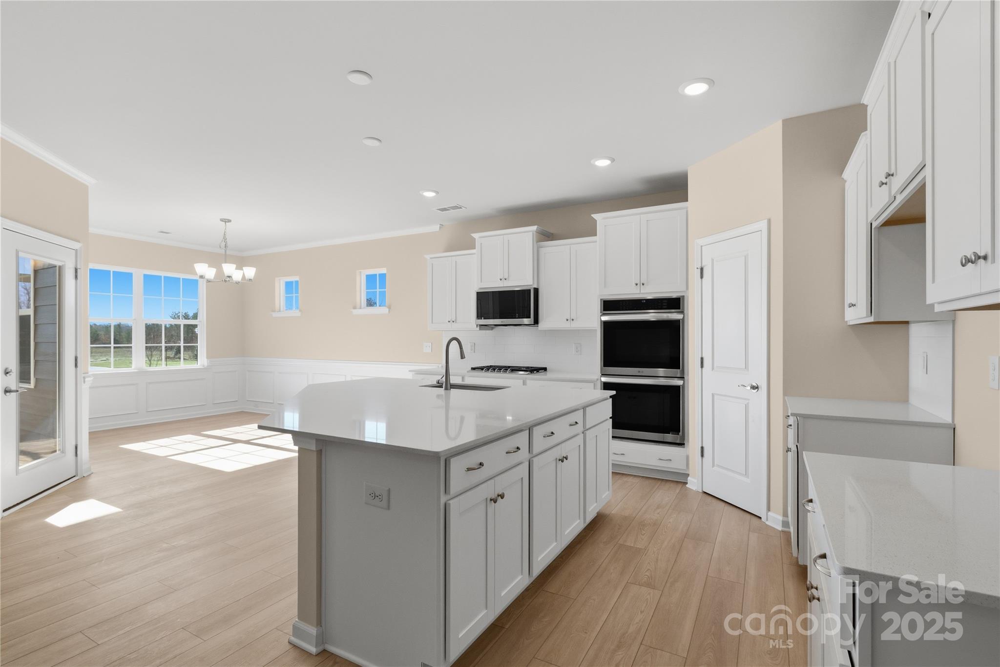 5404 Redbud Road Lancaster, SC 29720 - Photo 14 of 27 a kitchen with stainless steel appliances granite countertop a sink and cabinets