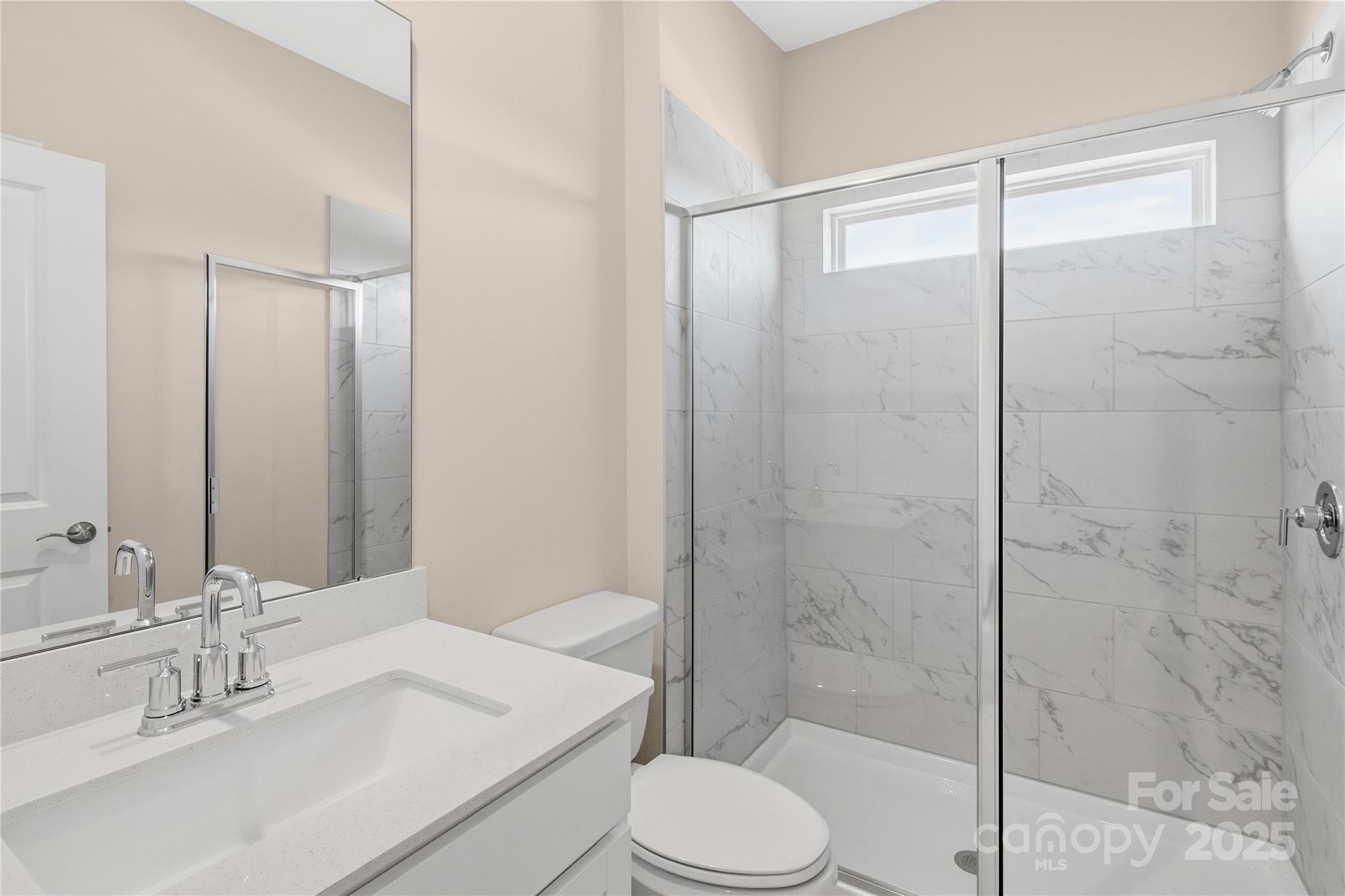 5404 Redbud Road Lancaster, SC 29720 - Photo 21 of 27 a bathroom with a sink toilet and shower