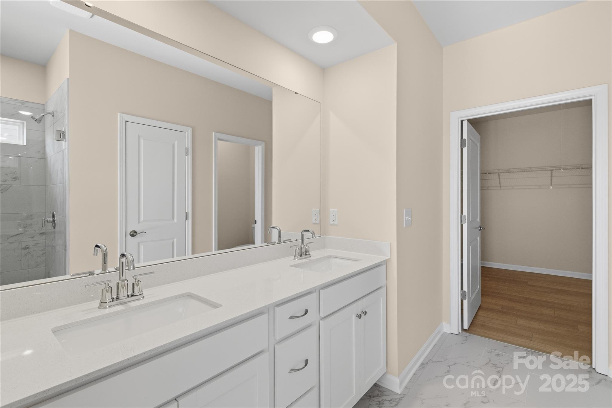 5404 Redbud Road Lancaster, SC 29720 - Photo 23 of 27 a bathroom with double sink and a mirror