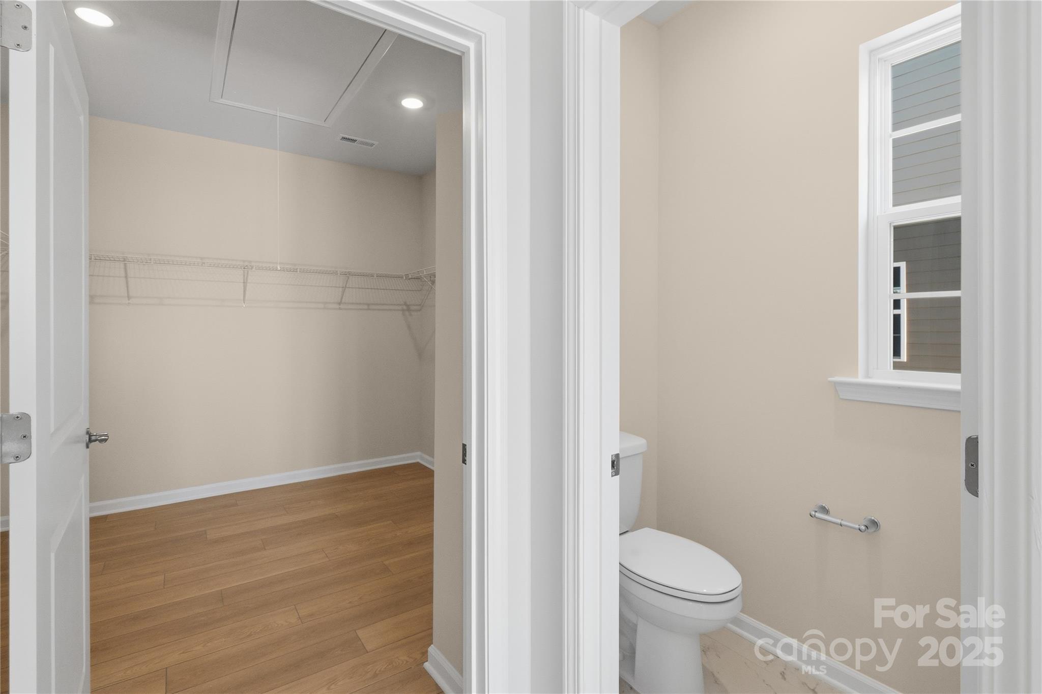 5404 Redbud Road Lancaster, SC 29720 - Photo 24 of 27 a bathroom with a granite countertop toilet and a shower