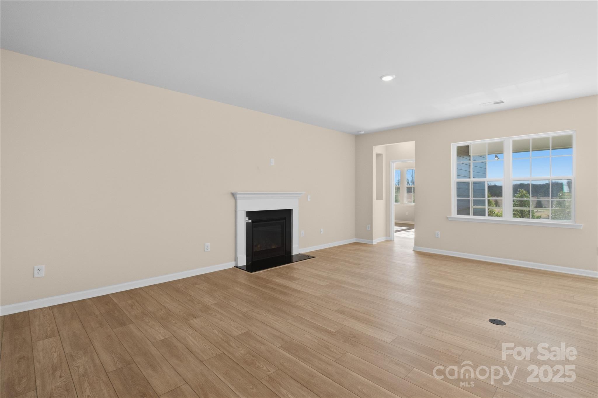 5404 Redbud Road Lancaster, SC 29720 - Photo 6 of 27 wooden floor in an empty room with a window