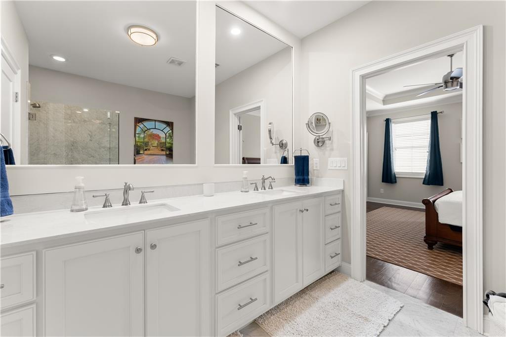3206 Ridge Towne Place Duluth, GA 30096 - Photo 24 of 42 a en suite bathroom with double sink and a mirror